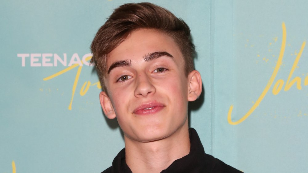 Johnny Orlando smiling on the red carpet