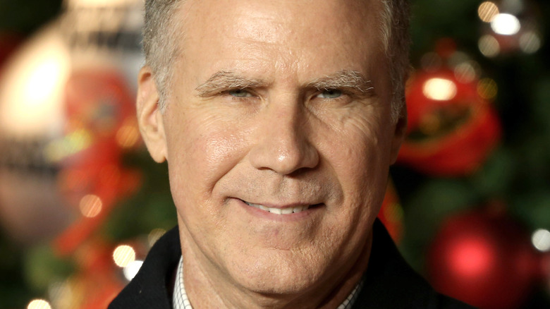 Will Ferrell in front of a Christmas tree