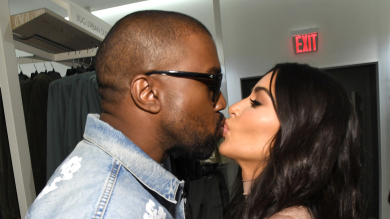 Kanye West and Kim Kardashian kissing