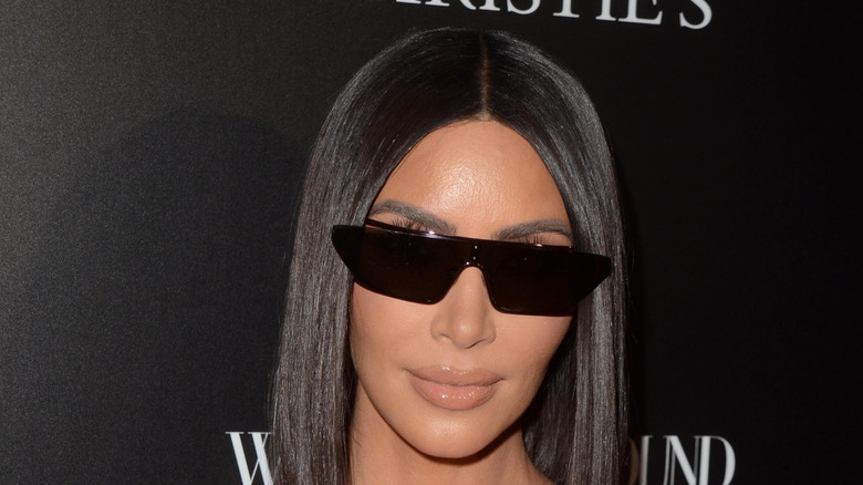 Kim Kardashian wearing dark glasses