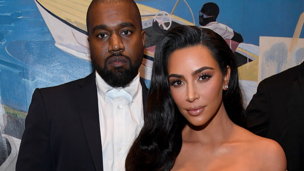 Kim Kardashian and Kanye West on the red carpet looking serious