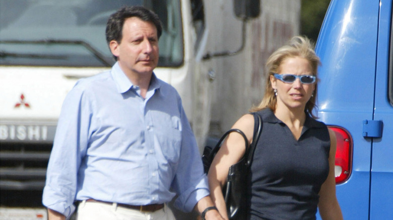 Katie Couric walking with Tom Werner