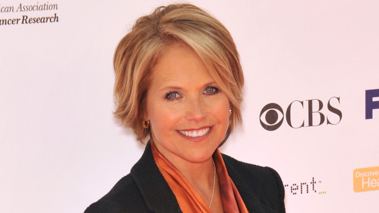 Katie Couric smiles on the red carpet 