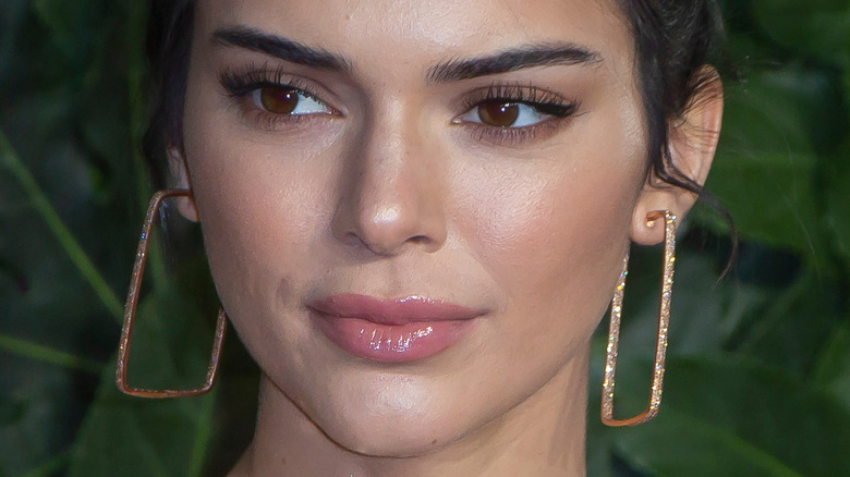 Kendall Jenner on the red carpet looking to the side with slight smile