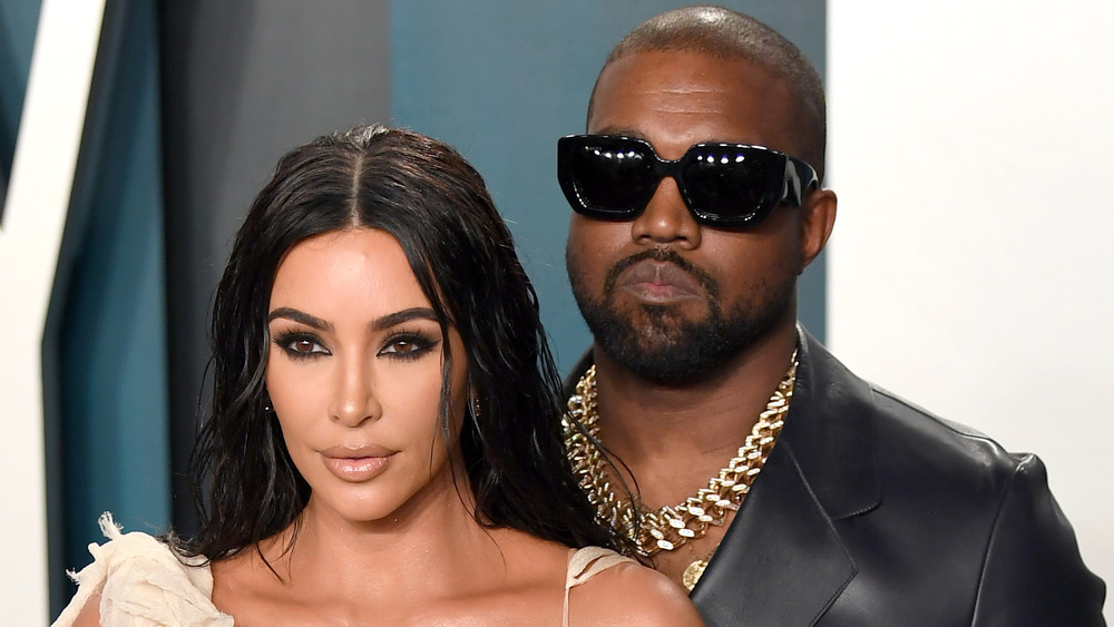 Kim Kardashian West and Kanye West posing for cameras