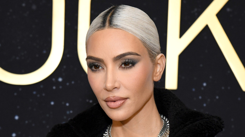 Kim Kardashian poses in platinum hair