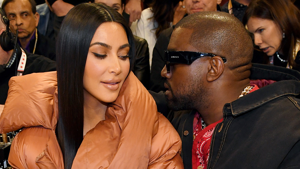 Kanye West and Kim Kardashian posing
