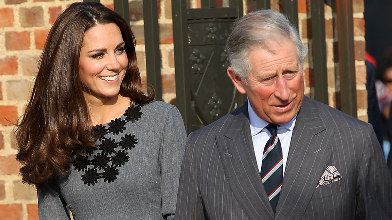 Kate Middleton and King Charles posing