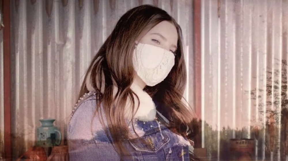 Lana Del Rey wearing a face mask in her music video 'White Dress'