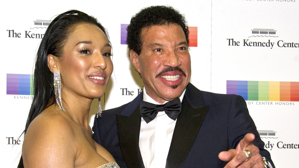 Lionel Richie and Lisa Parigi at an event 