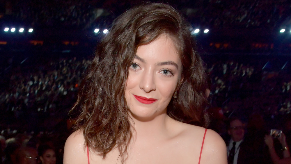 Lorde grinning at an award show