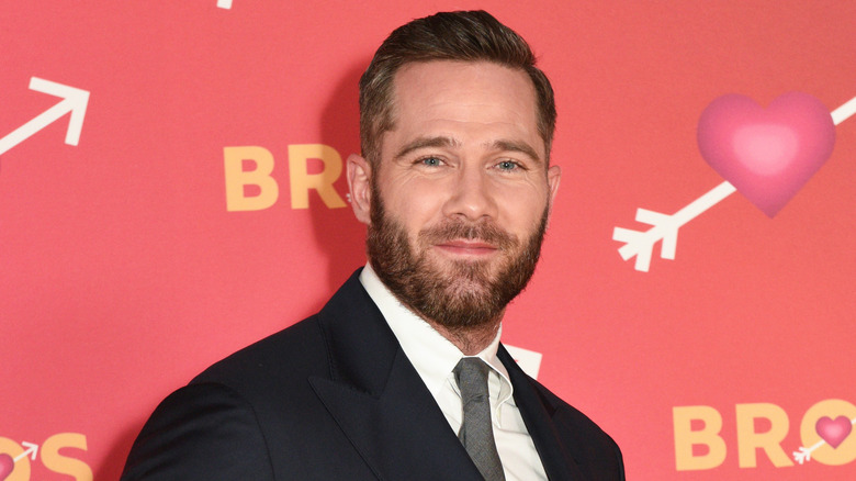 Luke Macfarlane posing on the red carpet