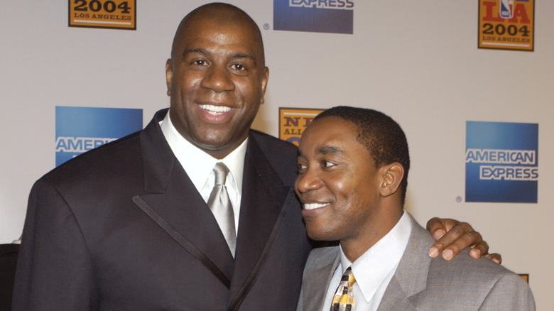 Magic Johnson and Isiah Thomas embracing