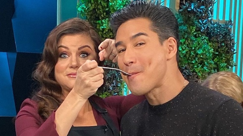 Tiffani Thieseen and Mario Lopez posing