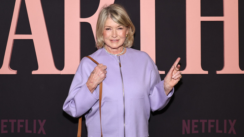 Martha Stewart wearing purple coat at the premiere of Netflix's 