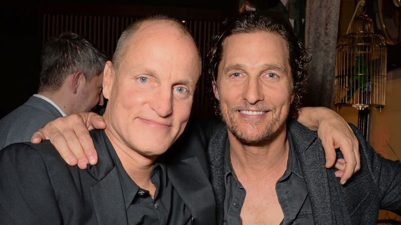 Matthew McConaughey and Woody Harrelson smiling