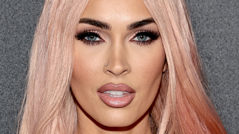 Megan Fox posing for photo with pink wig