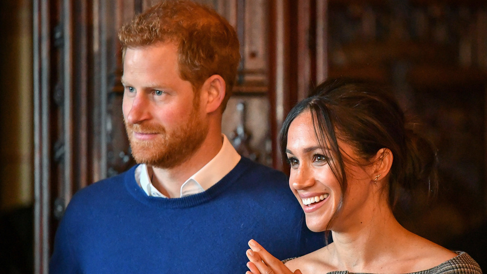 Prince Harry and Meghan Markle smiling