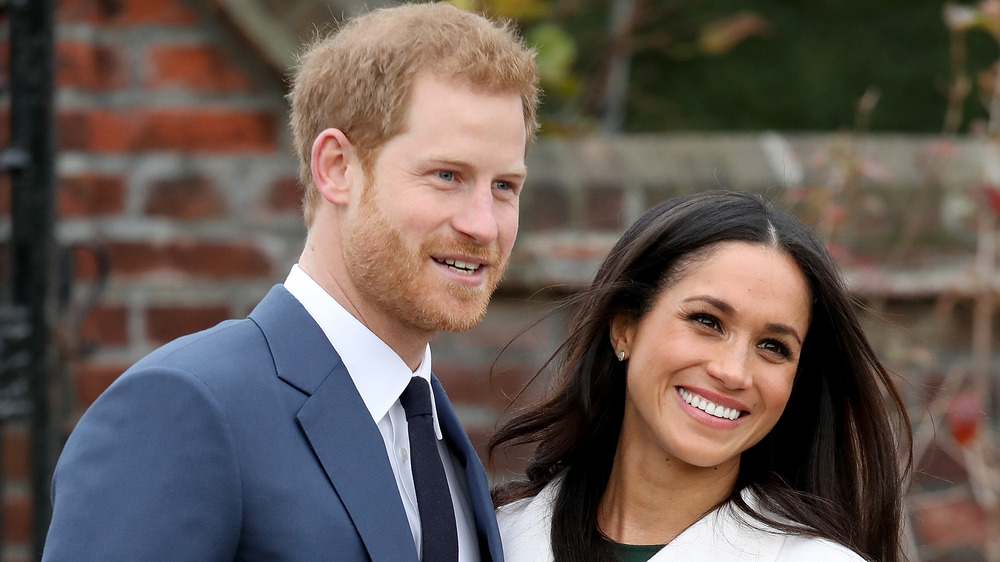 Prince Harry and Meghan Markle smiling