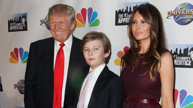 Donald, Barron, and Melania Trump posing