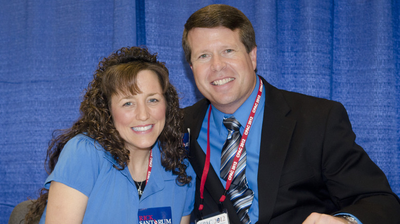 Michelle and Jim Bob Duggar smile while promoting their book