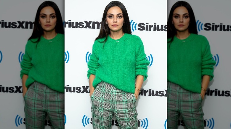 Mila Kunis green sweater plaid pants