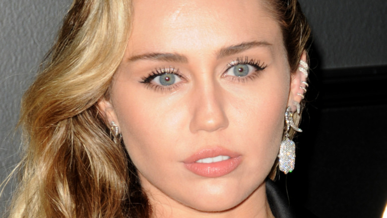 Miley Cyrus with a serious expression