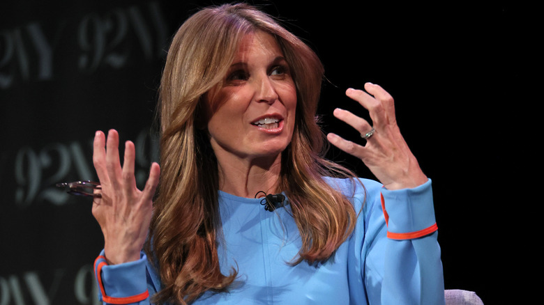 Nicolle Wallace speaking with both hands up