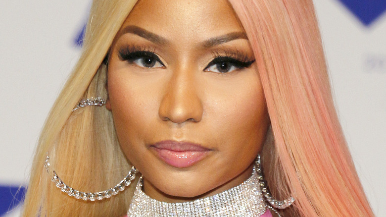 Nicki Minaj with serious expression on the red carpet