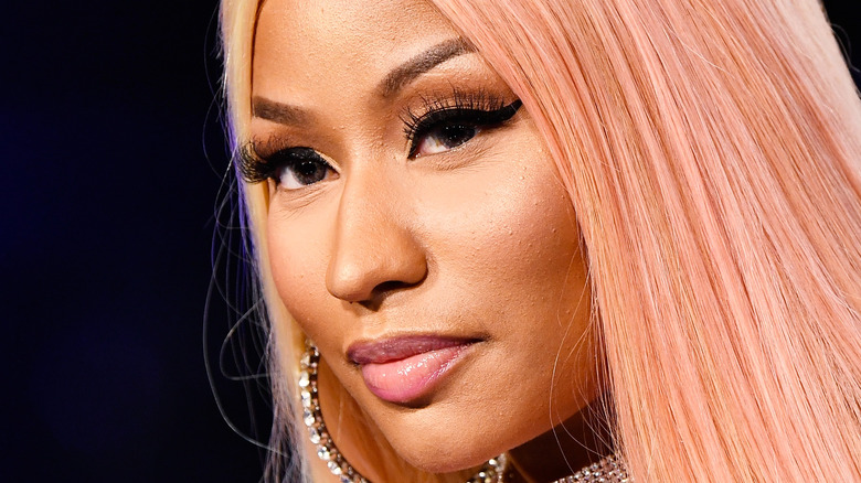 Nicki Minaj smirking