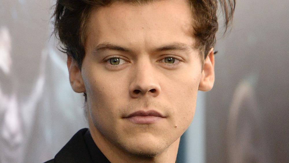 Harry Styles gives a serious stare