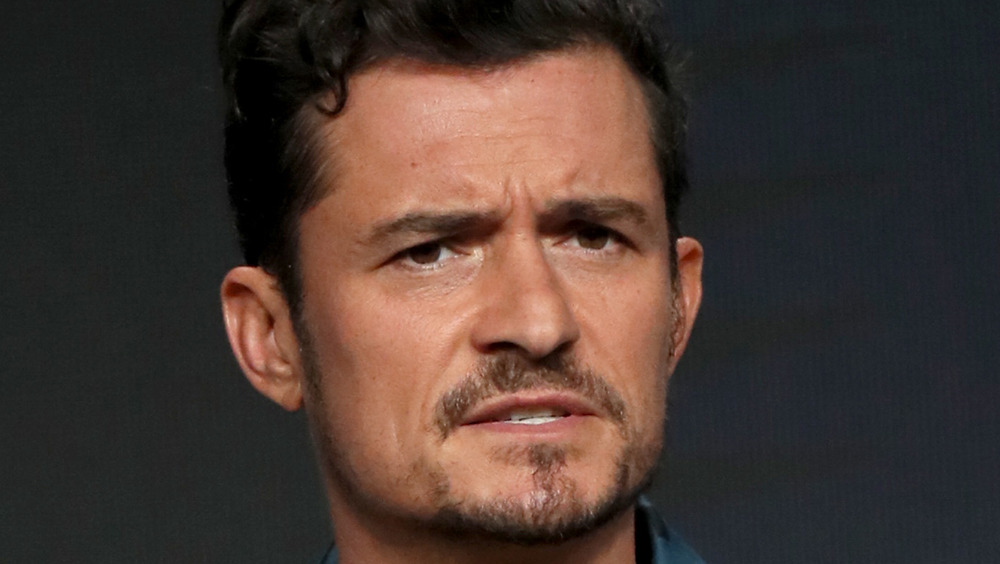 Orlando Bloom wincing