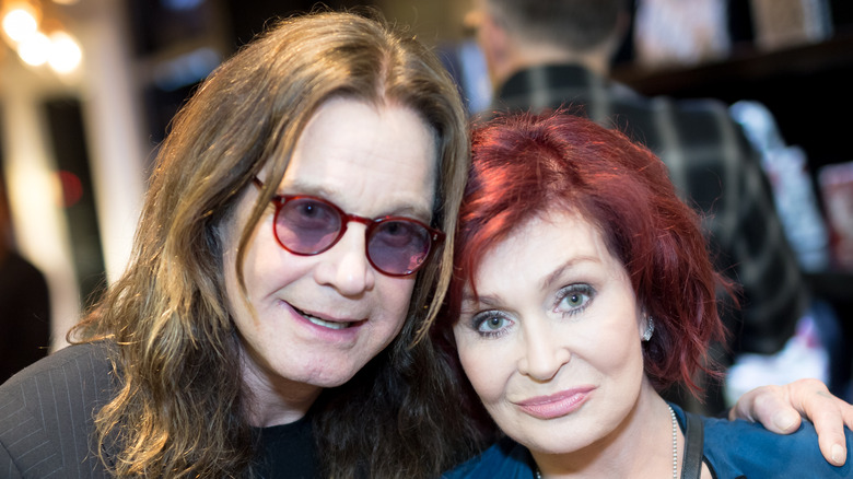 Ozzy Osbourne and Sharon Osbourne smiling in close-up