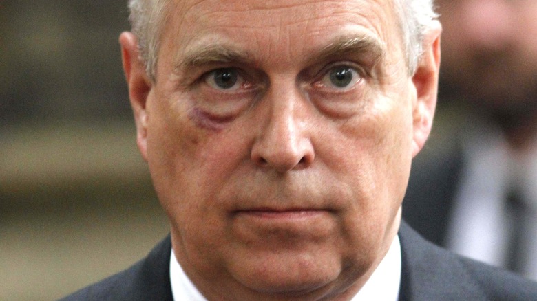 Prince Andrew looks at the camera in a close-up