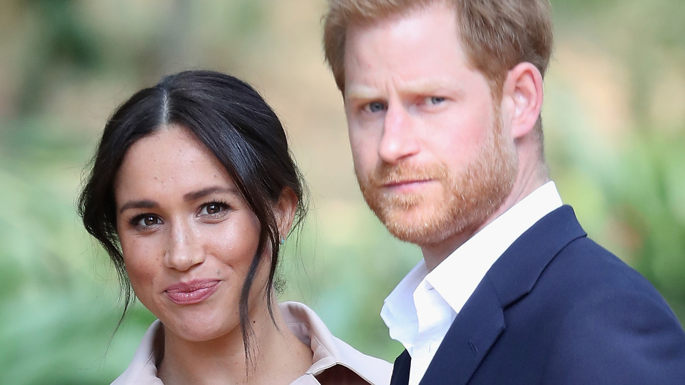 Meghan Markle and Prince Harry posing for the camera
