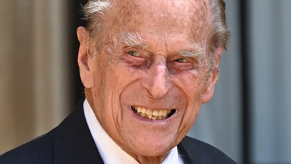 Prince Philip smiles while on royal duty