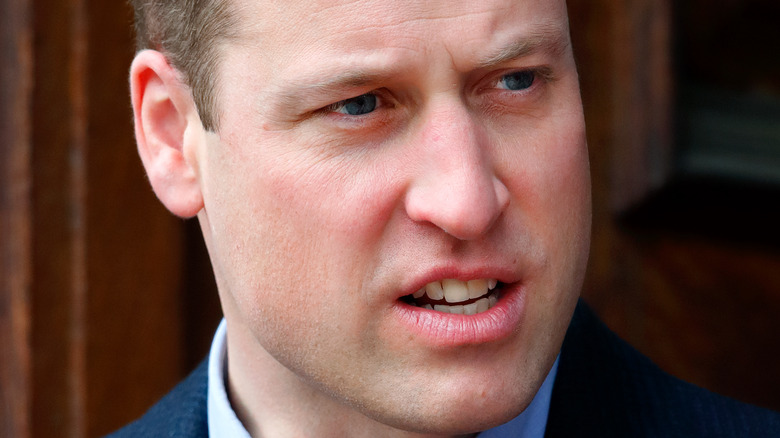 Prince William with a neutral expression