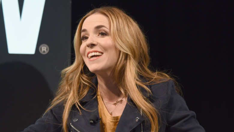 Rachel Hollis speaking at event