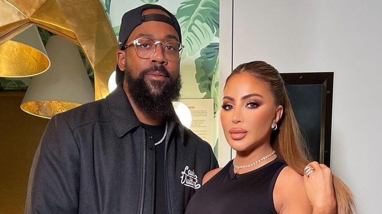 Marcus Jordan and Larsa Pippen posing together