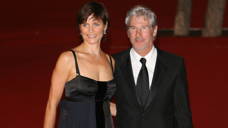 Richard Gere and Carey Lowell, both smiling