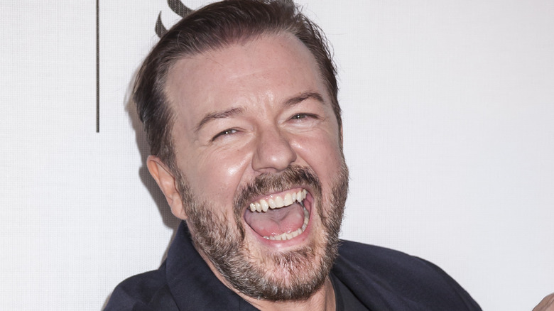 Ricky Gervais white teeth laughing