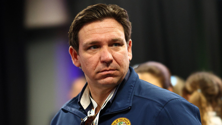 Ron DeSantis Blue jacket scowling