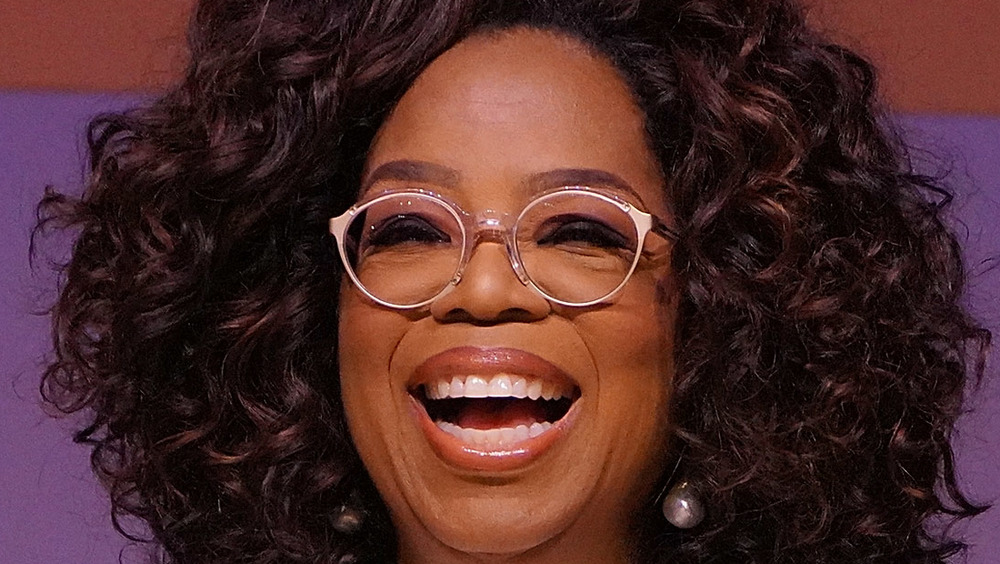 oprah smiling with big hair
