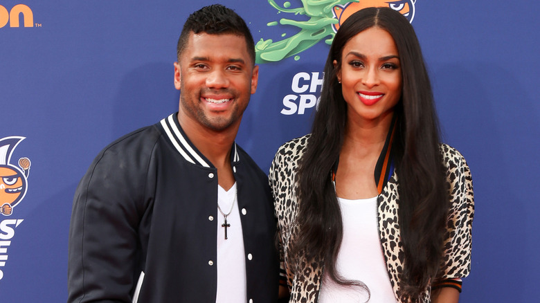 Russell Wilson and Ciara posing