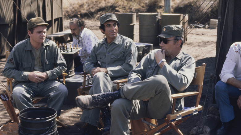Gary Burghoff, Jamie Farr and Larry Linville behind the scenes of M*A*S*H.