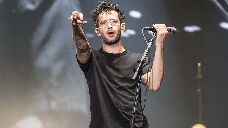 Matty Healy performing with cigarette