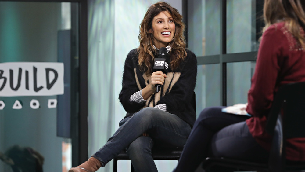 Jennifer Esposito sitting