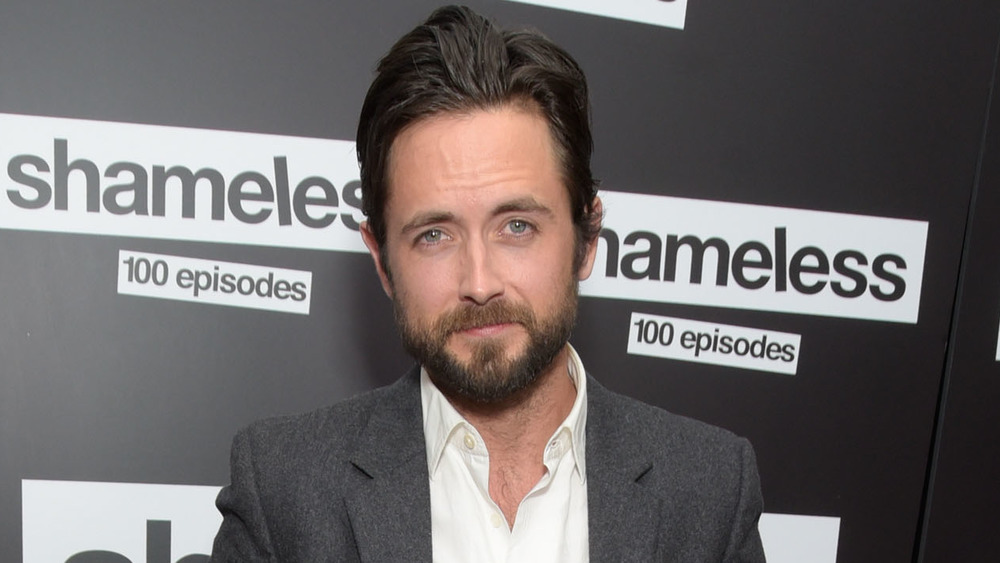 Justin Chatwin smirking 