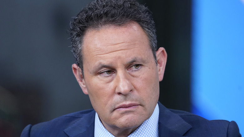 Brian Kilmeade looks off-camera on Fox & Friends