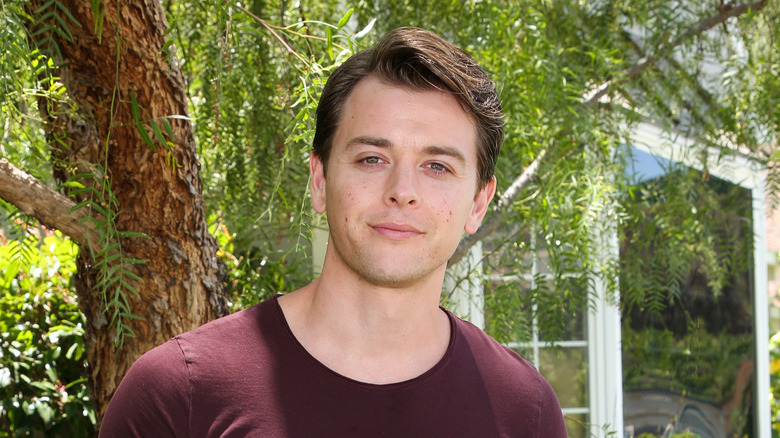 Chad Duell posing outdoors